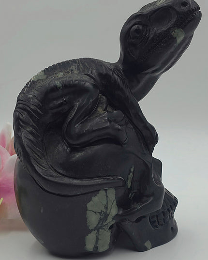 One-of-a-kind Peony Stone velociraptor on human skull carving xl