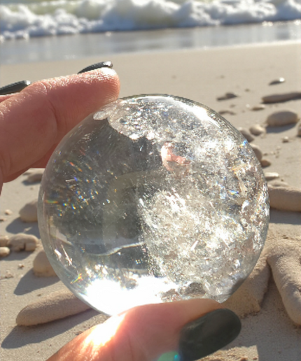 High grade clear quartz sphere with amazing rainbows