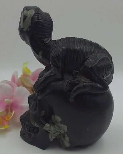 One-of-a-kind Peony Stone velociraptor on human skull carving xl