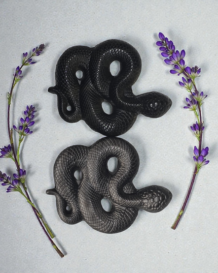 Obsidian snake carving
