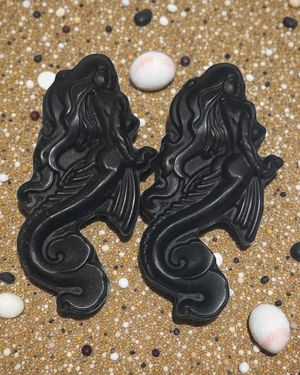 Black obsidian siren carving